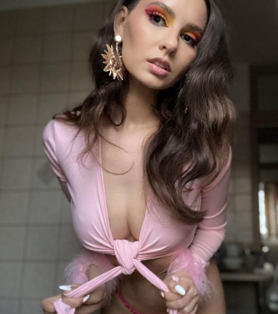 Beautiful and gentle girl with a wonderful figure shows herself naked