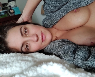 Interesting woman shows off her big tits at home